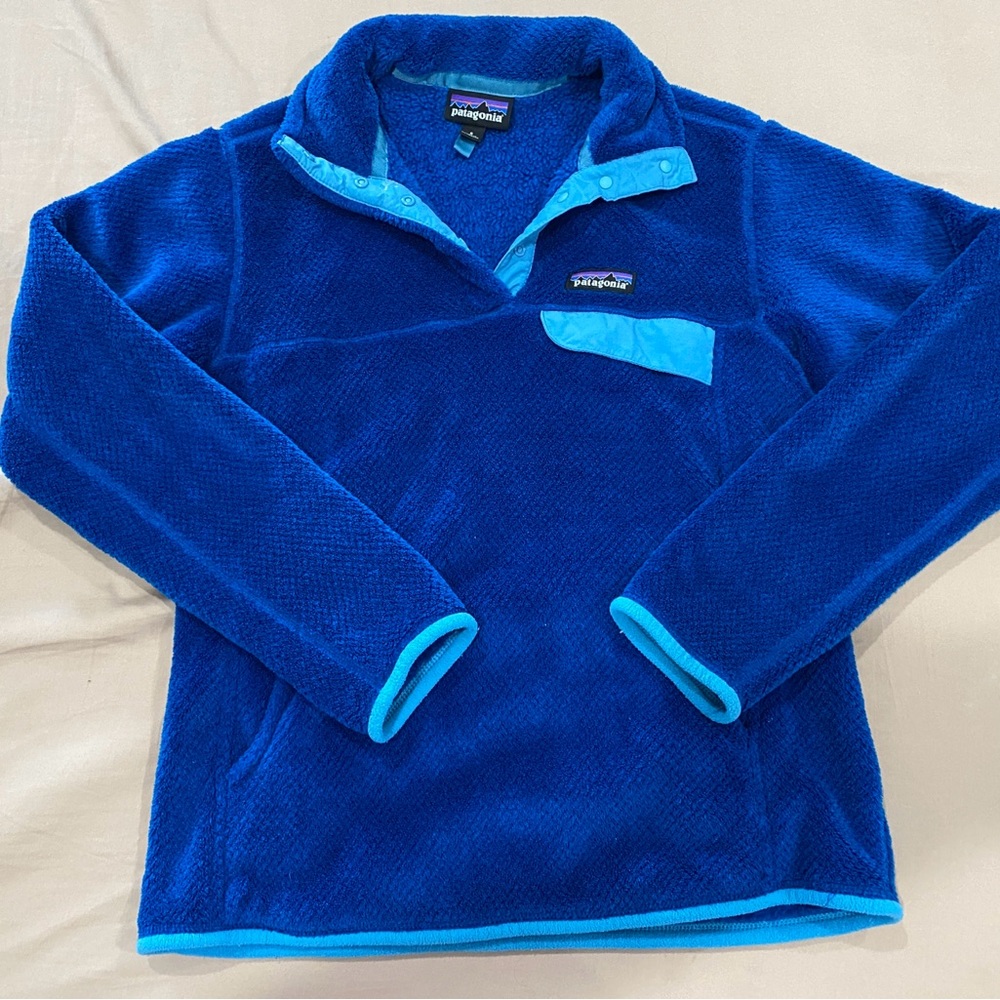 Patagonia Women’s S Snap Re-Tool Fleece in Royal Blue and light blue accents.